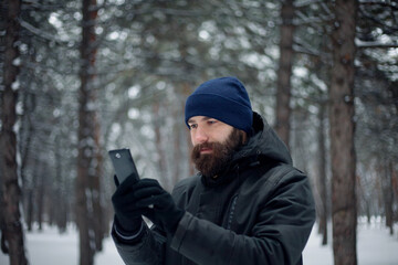 bearded guy playing snowballs