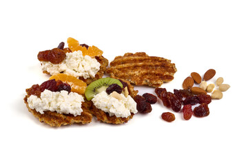 fresh desserts with cottage cheese with kiwi, nuts and raisins, isolated on white background.