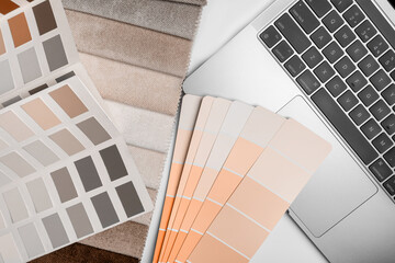 different types of fabrics with a color palette and laptop. New trending PANTONE Peach Fuzz color of 2024 year