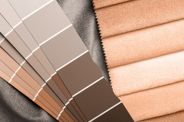 a variety of fabrics with a color palette. New trending PANTONE Peach Fuzz color of 2024 year