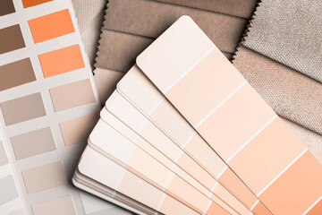 a variety of fabrics with a color palette. New trending PANTONE Peach Fuzz colour of 2024 year - 690565582