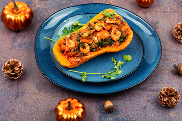 Baked pumpkin stuffed with vegetables and shrimp.
