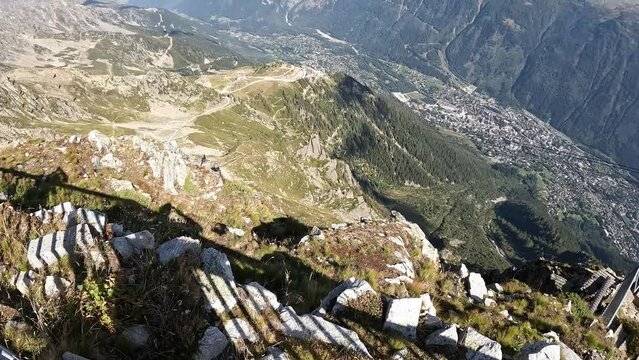 Alpine jackdaws, birds. View from the cable car, Le Brevent, French Alps, Chamonix. Beautiful mountain landscape, forest, rocks. Tourist walk