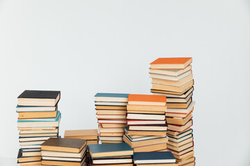 Stacks of old books in study library on white background