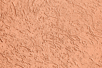 Decorative plaster. Peach Fuzz color.