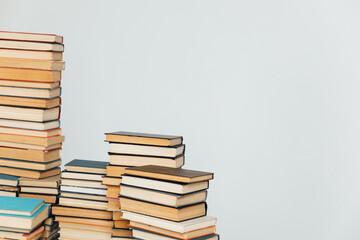 Stacks of old books in study library on white background