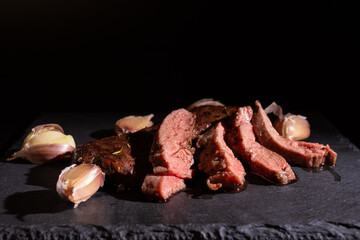 Vegas beef steak on a black plate