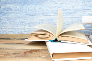 open book, books on the blue background. Back to school. Education. Copy space for text.