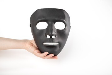 Drama festival, black mask in hand on white background, vintage costume, Masked identity,...
