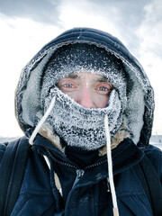 Male portrait of a polar explorer in the cold -40 degrees Celsius - obrazy, fototapety, plakaty
