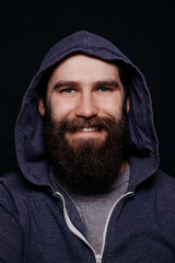 Handsome male beard in hoodies, studio shot black background