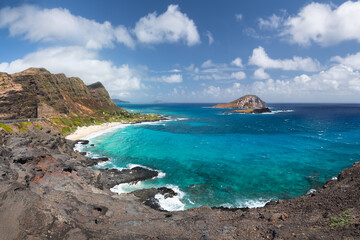Panoramic view of Makapuu Beach and bay with its turquoise waters and Manana Island in the...