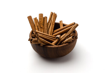 wooden bowl full of cinnamon stick with detail texture, isolated on white background, 45 degree shot