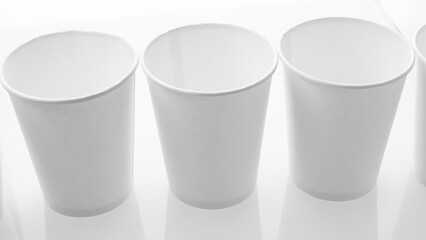 White cardboard cups on white background, blank for mockup design