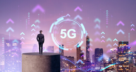 Rear view of businessman on a stand, skyline with 5G and smart city connection