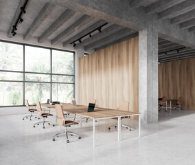 Modern coworking room interior with table and armchairs, panoramic window