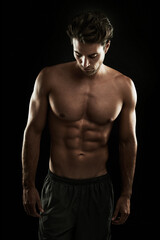 Topless, black background or body of man for bodybuilding workout, training or exercise in studio....