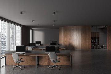 Grey office interior with coworking and glass conference room, panoramic window