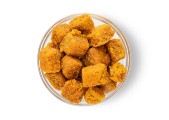 Sweet dried mango bites on white background.Top view.Macro.