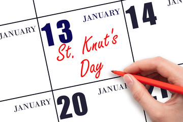 January 13. Hand writing text St. Knut's Day on calendar date. Save the date.