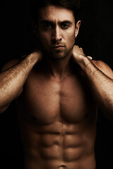 Fototapeta premium Abs, black background or portrait of model for workout, training or exercise in studio for fitness. Man, dark shadow or ripped male person with healthy body, six pack or stomach for wellness in Italy