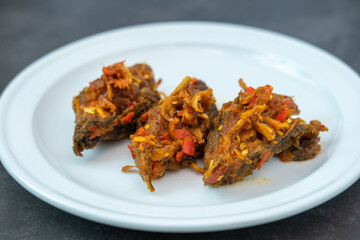 Traditional Thai spicy stir-fried catfish with curry paste Southern food, traditional recipe