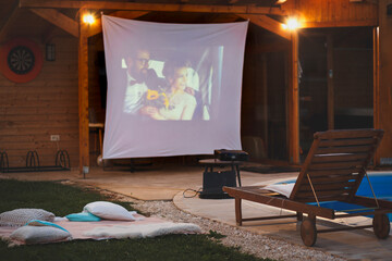 Home summer evening poolside open air cinema