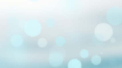 Fototapeta premium A bokeh background with blue and white circles. The circles are different sizes and are arranged in a random pattern. The background is blurred, which accentuates the bokeh effect.
