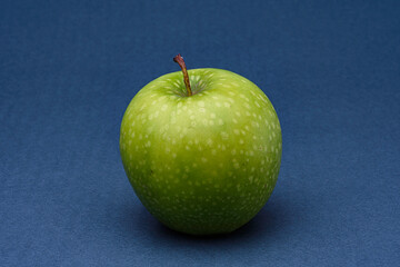 green apple on blue