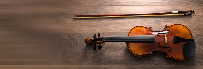 Classic violin on wooden background