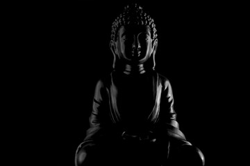 Buddha Purnima and Vesak day concept, Grey Buddha statue with low key light against deep black...