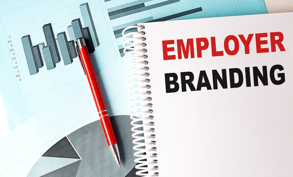 EMPLOYER BRANDING text on a notebook with pen on a chart background