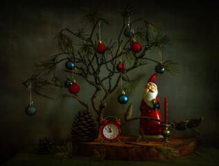The clock is counting down the last minutes until the New Year against the backdrop of a pine...