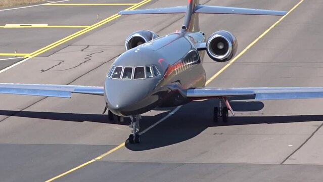 Black Business Jet Taxiing head on at Executive Airport