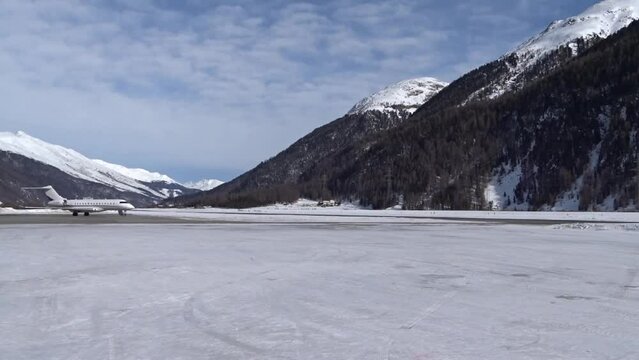 Overview Mountains Valley Airport Private Jet Parked Snow Runway Taxiway White Frozen Cold Trees