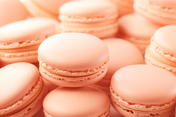 many vertical stacks of macaroons background in peach fuzz color - obrazy, fototapety, plakaty