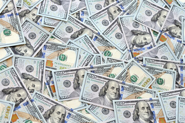 Very big amount of US hundred dollar bills close up. Huge quantity of united states currency notes on flat table