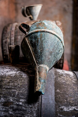 Old vintage wine barrels, an old metal watering can 