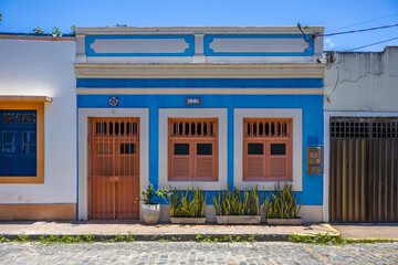 Facades with colorful houses fill the urban scene with traditional architecture in the historic...