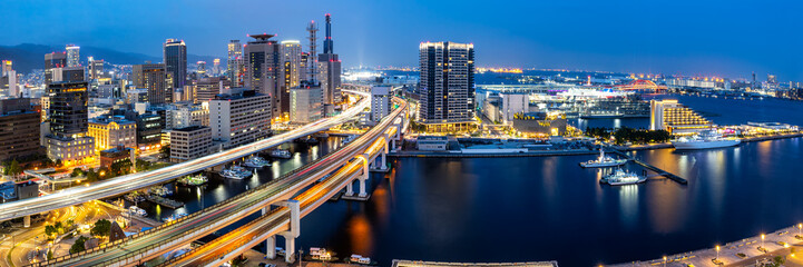 Kobe skyline from above with port and elevated road panorama at twilight in Japan - obrazy, fototapety, plakaty