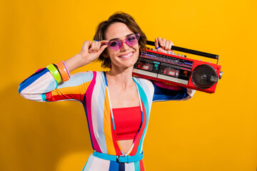 Photo of positive girl having boom box for disco party on christmas new year isolated vivid color background