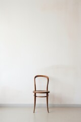 A lone chair in an empty room isolated on white background