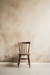 A lone chair against a wall isolated on white background 