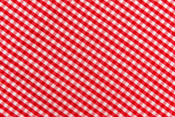 The texture of linen fabric in a large cage of red  and white. Scottish tailoring material. Checkered fabric - obrazy, fototapety, plakaty