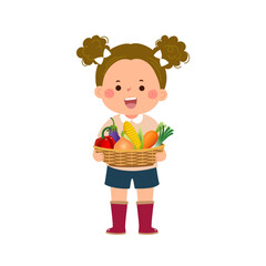 Farmer girl holding basket full of fresh vegetables