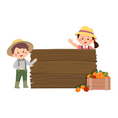 Gardener kids with wooden board and wooden boxes of fruits