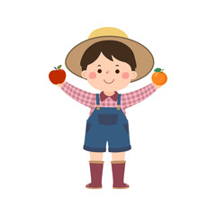 Little boy gardener holding orange and apple
