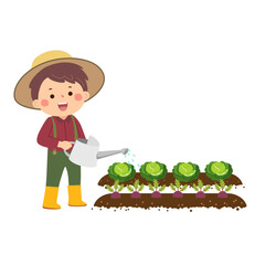 Little gardener watering vegetables in garden