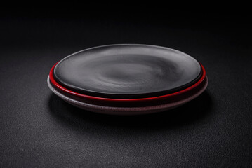 Bumpy empty ceramic plate on a textured concrete background