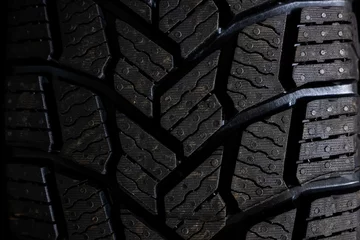 Fotobehang Studless snow tire close-up macro shot landscape © Macky Albor